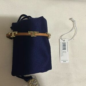 Tory Burch Serif-T tan leather band bracelet.